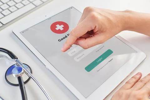 Close up shoot of a doctor's hands using a digital tablet 库存照片