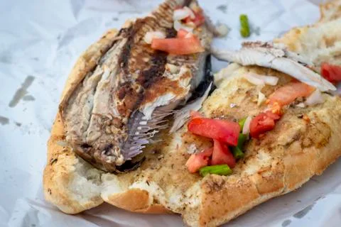 Close-up shoot of fish and bread food on the street Stock Photos