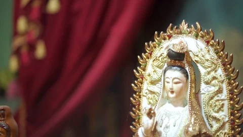 Close Up Shoot of Goddess of Compassion Guan Yin in traditional and religious Stock Footage 99333568