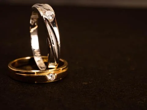 Close up shoot of gold wedding ring with beautiful diamond Stock Photos