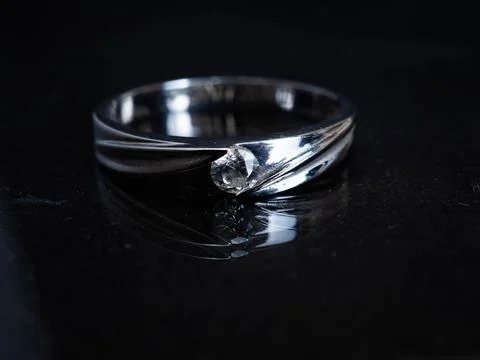 Close up shoot of gold wedding ring with beautiful diamond Stock Photos