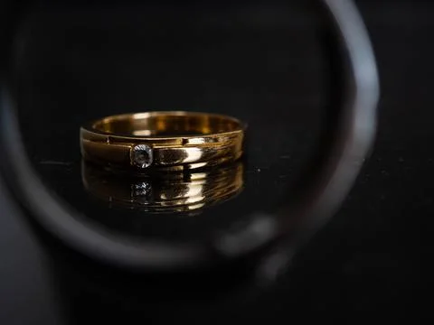 Close up shoot of gold wedding ring with beautiful diamond Stock Photos