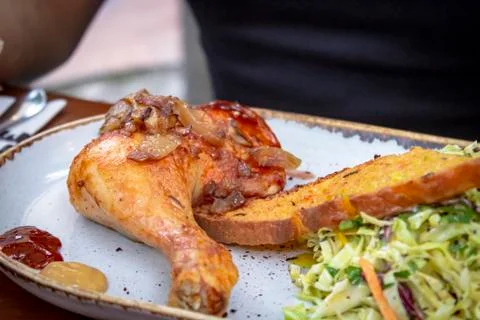 Close-up shoot of grill chicken and salad on table Stock Photos