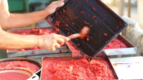 Close-up shoot of homemade tomato paste making Stock Footage 93797833