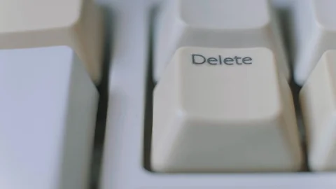 Close-up shoot of human finger repeatedly pressing the delete key on a keyboard. Stock Footage 123721531