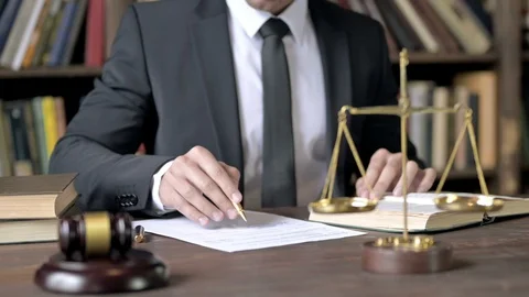 Close up Shoot of Judge Hand Checking Document in Court Room Stock Footage