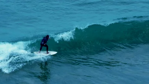 Close up shoot of a man Surfing at dusk Stock Footage 133514913