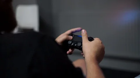 Close up shoot with man's hands keep the joystick. He active play in video game. Stock Footage 110905504