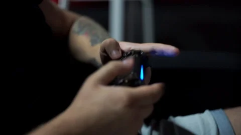 Close up shoot with man's hands keep the joystick. He active play in video game. 스톡 동영상 110905509