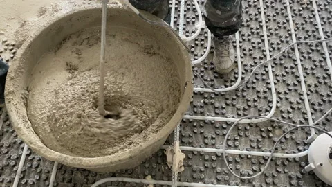 Close up. Shoot of mixing concrete using an electric mixer. 스톡 동영상 229499334