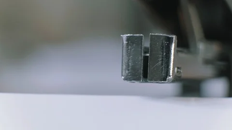 Close-up shoot of a stapler stapling paper in the office. Stock Footage 123724170