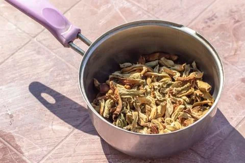 Close-up shoot of string beans dried under the sunlight in cooking pot Stock Photos