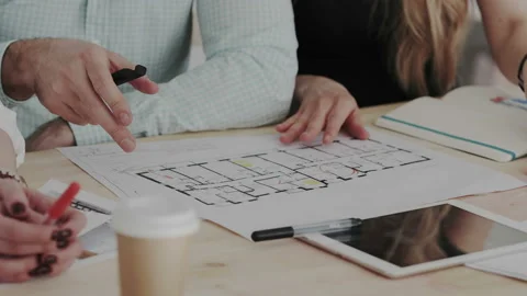 Close up shoot. Three skilled specialist discuss an architectural object Stock Footage 106201051