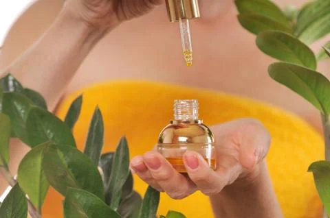 Close up shoot of woman's hands with essential oil Stock Photos