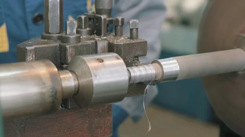 Close-up shoot of a worker using a lathe to carve a metal tube. Stock Footage 123723876