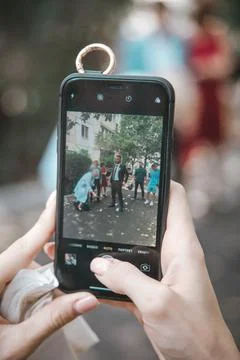 Close-up shooting of the event on a smartphone Stock Photos