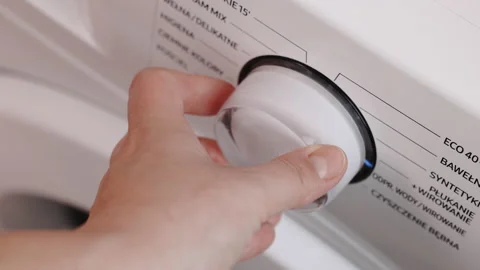 Close Up Shooting with a Hand Rotating the Front Panel Button, Switching Off the Stock Footage 232012680