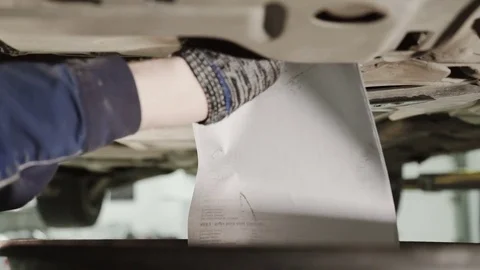 Close up shooting hand of Worker opens lid, oil flows from bottom Stock Footage 76461192