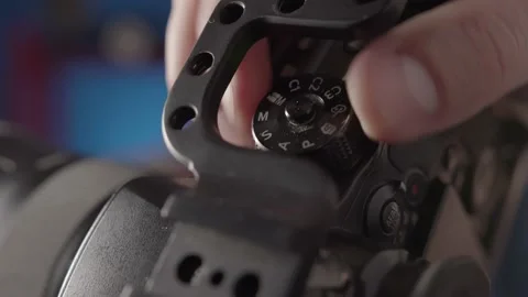A close-up of the shooting mode settings on the camera. Stock Footage 234541674