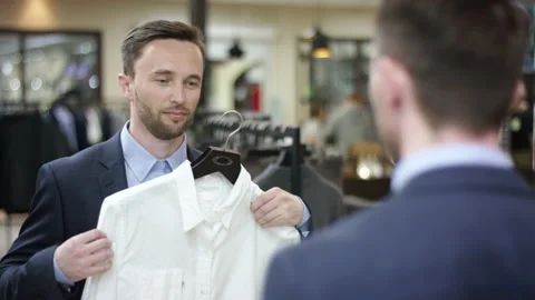 A close up shooting over the shoulder of a dark haired business man in a Stock Footage 139535983