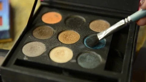 Close-up shooting of palette with eye shadow brush for bright make-up Stock Footage 74153896