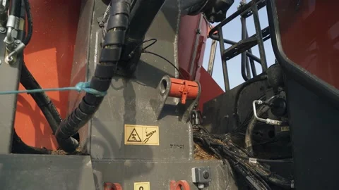Close-up shooting of a red combine harvester at the enterprise Video stock 201446550