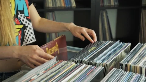 Close up of shoppers purchasing vinyl records Stock Footage 74743671
