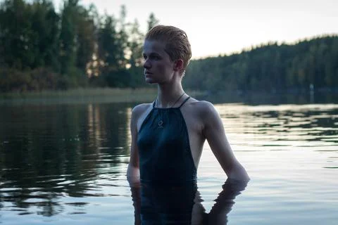 Close up short haired model in river at sunset portrait picture Stock Photos