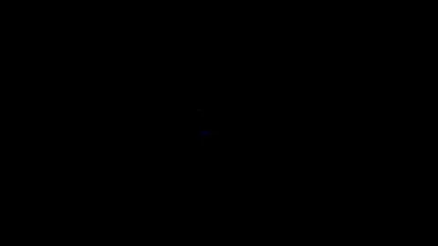 Close-up shot of an abstract glowing red light pulsating continuously against Stock Footage 340588873