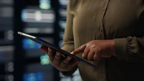 Close up shot of admin working in data center using tablet Stock Photos