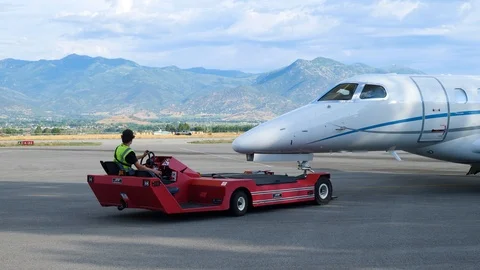 Close up shot as aerotow driver pulls the business jet Stock Footage 116561032