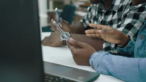 Close up shot of african students using tablet in library. Stock Footage 101889055