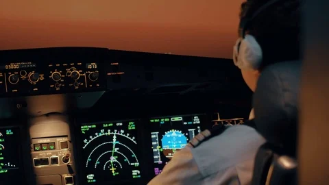 Close shot of aircraft cabin or cockpit - Second pilot changes parameters of aut Stock Footage 71804973