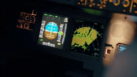 Close shot of aircraft cabin or cockpit. Flight deck centre panel with primary f Stock Footage