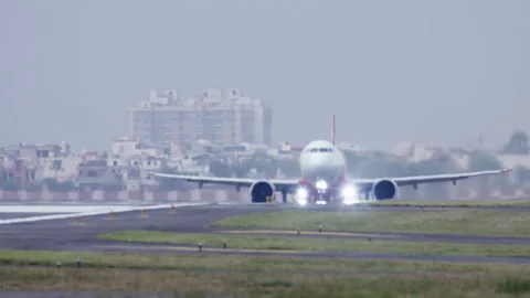 A close up shot of Airplane taking off Flight becoming airborne from the runway Stock Footage 254145480