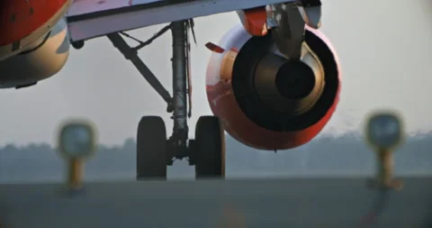 Close-Up Shot of Airplane Wheels Moving on Runway Stock Footage 280491376