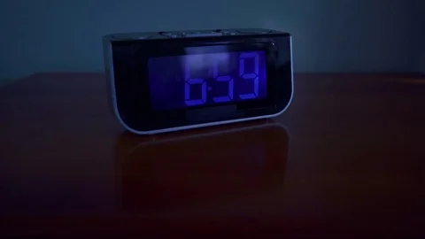 Close up shot of alarm clock turns 7 AM Stock Footage 76430546