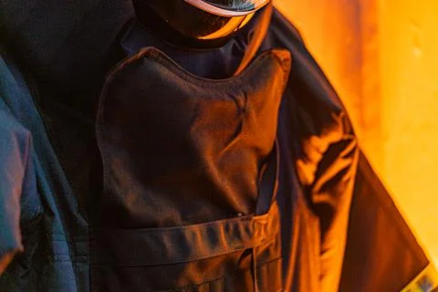 Close-up shot of an anonymous deminer in an EOD suit, with a blurred backgr.. Stock Photos