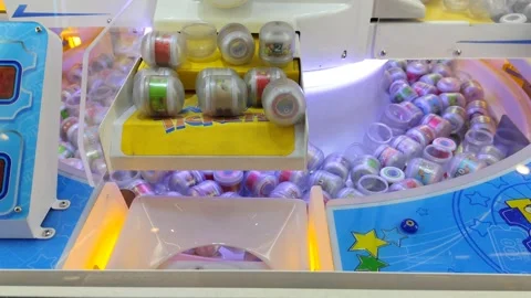 A close-up shot of an arcade vending machine with colorful capsules Video stock 302367499
