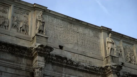 Close up shot of the Arch of Constantine in front of the Colosseum in Rome Stock Footage 214299225