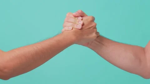 Close up shot of arm wresting of two men in isolate green screen in background. Stock Footage 164938726