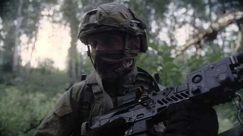 Close-up, shot of an armed special forces soldier with rifle in his hands Stock Footage 327352499