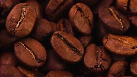 Close-up shot of aromatic roasted whole coffee beans as a natural background. Stock Footage 150153287