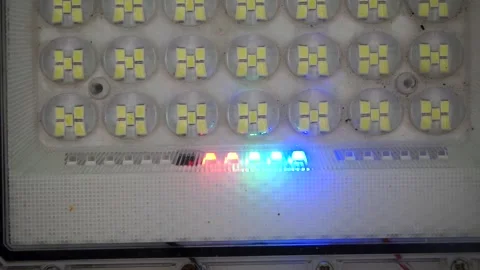 Close-up shot of an array of LED floodlight diodes featuring an active glowing 库存影片 344329269