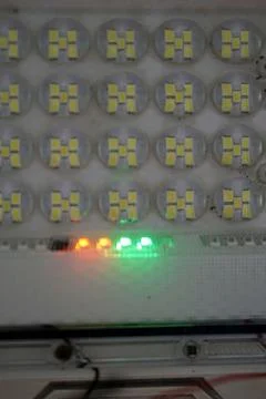 Close-up shot of an array of LED floodlight diodes featuring an active glowing Stock Photos