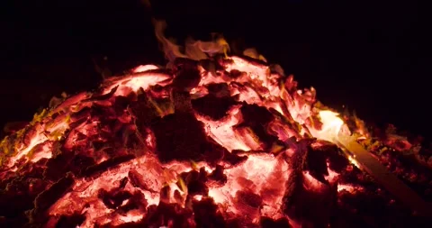 Close shot of ashes from bonfire whit small flames burn embers. slowmotion Stock Footage 277351591