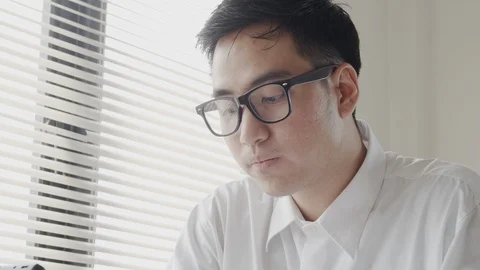 Close up shot Asian businessman using smartphone sitting working  at office Stock Footage 113254500