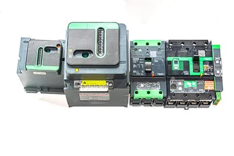 Close-up shot of assorted electrical devices on a gray table, predominantly.. Stock Photos