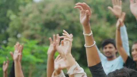 Close up shot of audience or crowd waving hands watching sports match at stadium Stock Footage 220494798