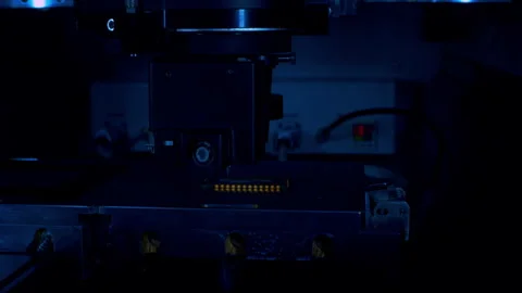 Close up shot of automated microchip placement in a dark moody atmosphere Stock Footage 337072266